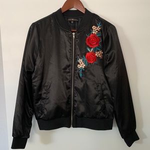 Black bomber jacket with rose design appliqué
